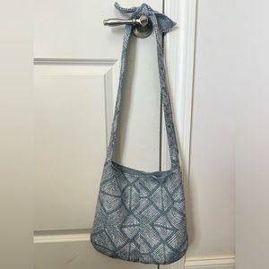 Reversible side body bag with blue and white pattern